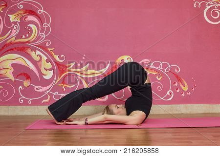 Fitness or yoga class sport woman doing exercise in gym