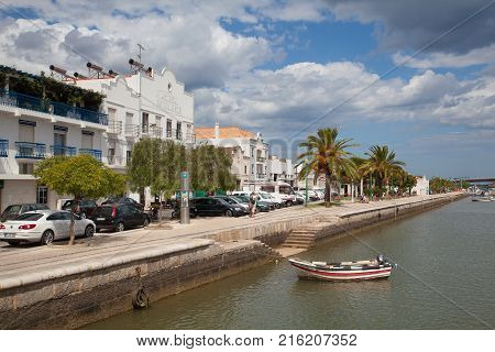 Tavira Portugal - July 2 2014: View of Tavira via the Gilao River on the southern Portuguese coast of the Atlantic. Tavira is an ancient Moorish town that has retained its unique character and heritage to become one of the finest resort towns of the Algar