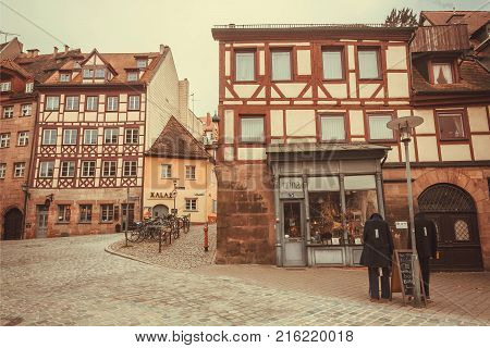 NUREMBERG, GERMANY - NOVEMBER 15, 2017: Old Bavarian city with fashion store and traditional homes on November 15, 2017. Nurnberg is second-largest city in Bavaria popul. 763854.