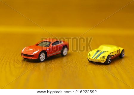 Toy Cars Red And Yellow On A Wooden Background