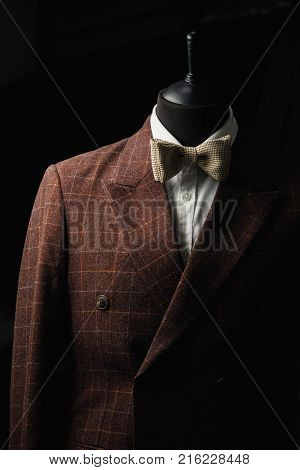Stylish men's suit. Men's jacket on a mannequin. Men's Clothing. Mannequins in the window of the boutique. Clothing store. Shopping in boutiques.