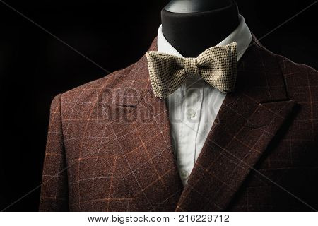 Stylish men's suit. Men's jacket on a mannequin. Men's Clothing. Mannequins in the window of the boutique. Clothing store. Shopping in boutiques.