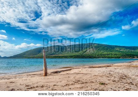 Beach In A Sunny And Cloudy Day