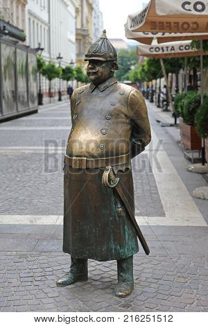 BUDAPEST HUNGARY - JULY 13 2015: The Fat Policeman Brass Statue at Zrinyi Street in Budapest Hungary.