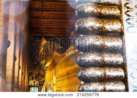 Reclining Buddha gold statue. Wat Pho Bangkok Thailand.