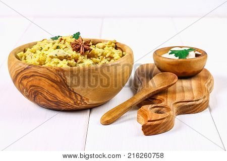 Indian Biryani With Chicken, Yogurt And Spices In A Plate On A Wooden Table. New Year's, Christmas D