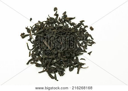 Pile of leaves quality black tea Earl Gray on white background