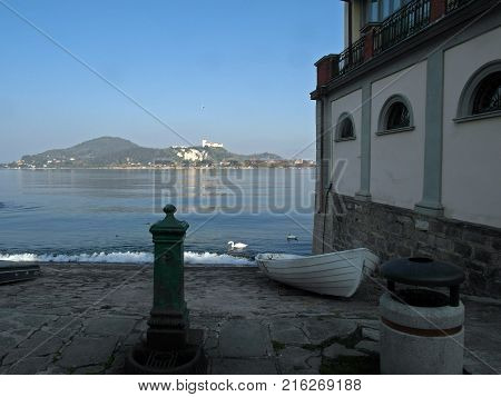 View of Lake Maggiore from the coast of Arona with dry boat