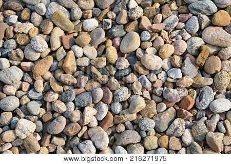 background of small multi-colored river rock stone texture