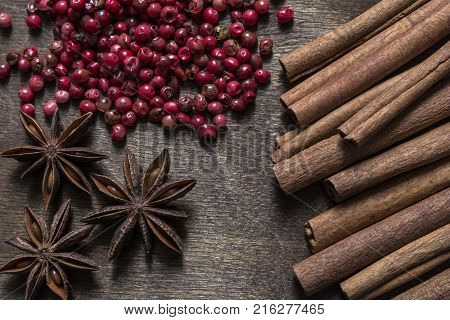Cinnamonstar anise and red pepper are on the table