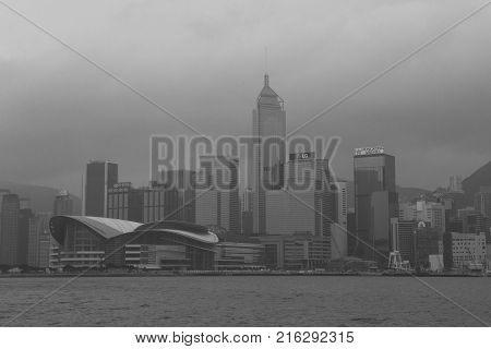 HONG KING HARBOUR, HONG KONG - OCT 19, 2017: Rain and mist changes the view of Hong Kong city from the harbour.