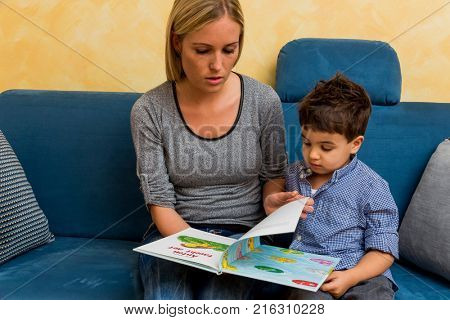 mother and son with a book
