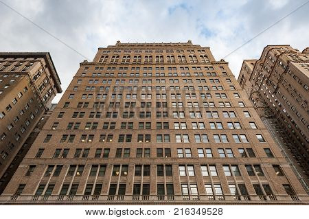 New York City, USA - Nov 10, 2017 : New york City building low angle view at the angle of 7th ave and w31st