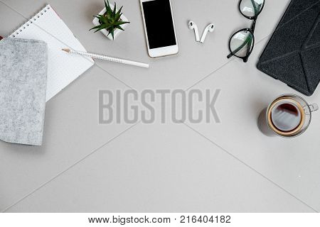 Woman Hands With Laptop, Spectacles And Coffee Cup On Brown Office Desk. Top View. Flat Lay