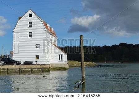 WOODBRIDGE, SUFFOLK, ENGLAND - APRIL 17, 2017: Woodbridge Quay and Tide Mill on the river Deben  Suffolk.