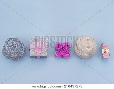 Festive decorative objects on a blue background. Wrapped gifts. Top view Flat lay