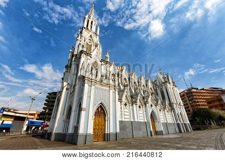 CALI, COLOMBIA - JUNE 11: Unidentified people walk past the Gothic La Ermita Church in Cali, Colombia on June 11, 2016.