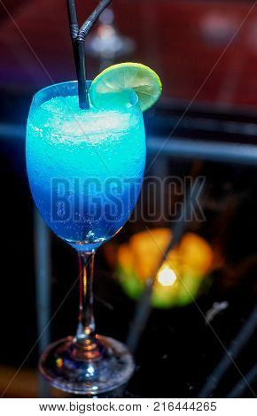 close up Blue cocktail with lime in glass