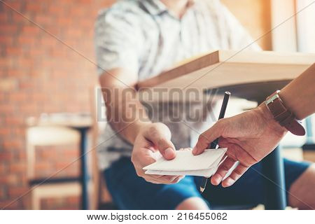 High School Or College Students Studying And Reading Together In Library