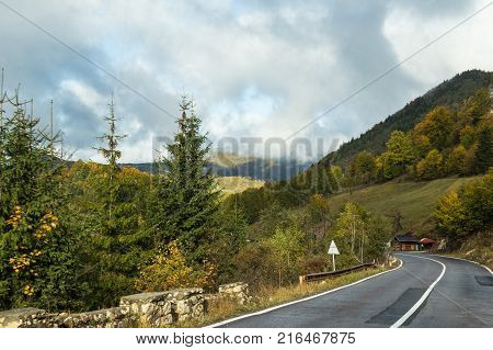 The road is an early rainy morning. Transylvania Romania