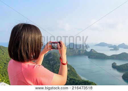 Woman Tourist On Peak Viewpoint Of Island