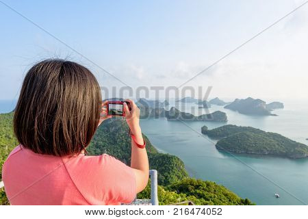 Woman Tourist On Peak Viewpoint Of Island