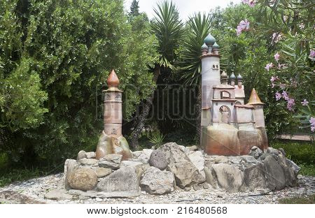 Dederkoy, Tuapse District, Krasnodar Region, Russia - July 14, 2013: Ceramic figure in the landscape design of pension Green Guy