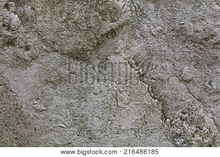 Gray and white rough natural stone surface grunge background texture close up