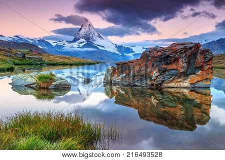 Stunning panorama with Matterhorn at morning and beautiful alpine lake, Stellisee, Valais region, Switzerland, Europe