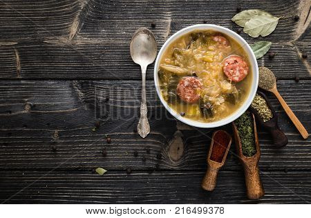 Slovak christmas cabbage soup with mushrooms on natural background.