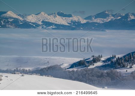 view of the mountain peaks above the clouds in Montenegro