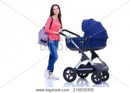 Full length portrait of a mother with a stroller, isolated on white background. Young mom