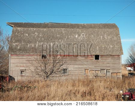 A old Barn on a abandoned farmstead with lots of abandoned
junk on the farmstead.
