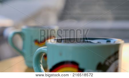 Steaming Cup of Hot Mulled Gluehwein at German Market in British Town.