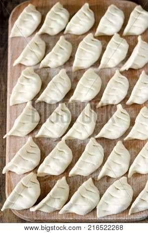 Many Raw Jiaozi Or Gedza Chinese Dumplings, Common In East Asia.