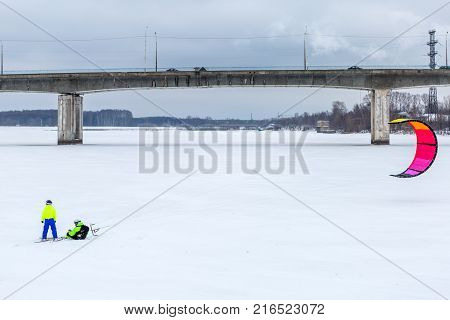 Winter Snowkiting on the lake. Outdoor extreme activities in winter snowkite