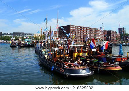 Amsterdam, The Netherlands - August 22, 2015: ships in de harbor of Amsterdam during the largest free public event in the Netherlands, Sail Amsterdam 2015.
