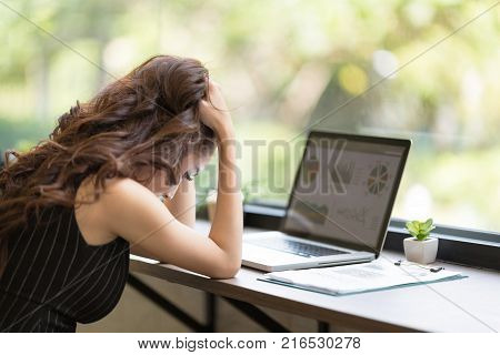 Tired And Unhappy Young Business Woman Using New Technology Gadget Connecting Distance Meeting. Business Freelance Coworking Space Luxurious Serviced Office For Rent Concept.