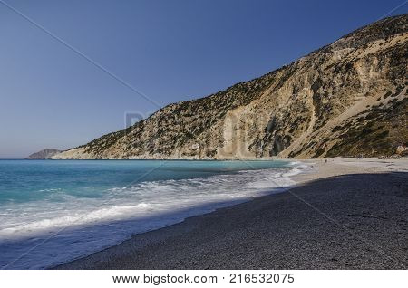 The marble and calcareous stones that fall from the adjacent mountains are turned into pebbles and then powdered by the strong waves of Myrtos beach in Kefalonia