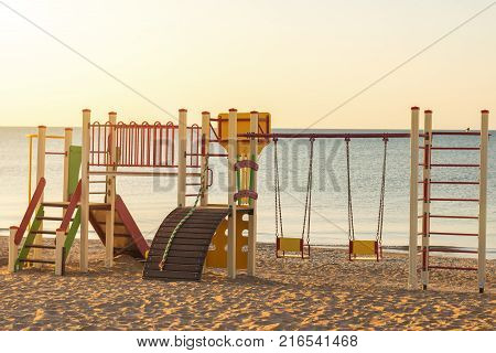 Bright and colorful children's Playground on the ocean. Playground for children near the sea.