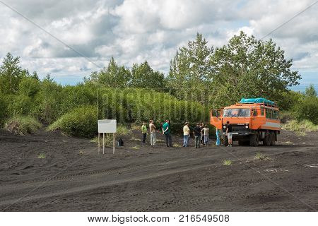 Kamchatka Peninsula, Russia - August 20, 2016: Tourist group on the road to the Klyuchevskoy Nature Park. Kamchatka Peninsula.