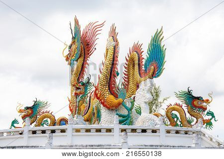 Nakornsawan, Thailand. - October 8, 2017 : Beautiful giant or big colorful dragon statue with blue sky at Nakornsawan Park, Thailand.
