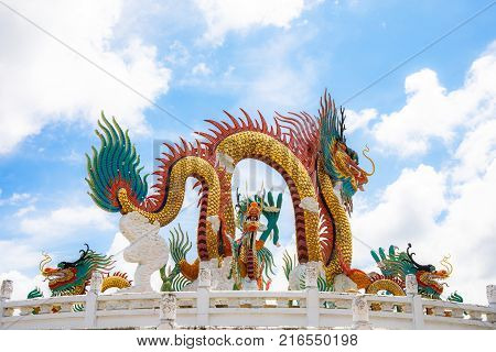 Nakornsawan, Thailand. - October 8, 2017 : Beautiful giant or big colorful dragon statue with blue sky at Nakornsawan Park, Thailand.