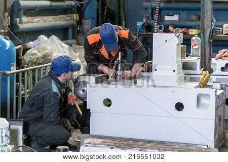 Lipetsk, Russia - June 15, 2017: Lipetsk Machine Tool Plant. Locksmiths are working on assembling a new metal-cutting machine.