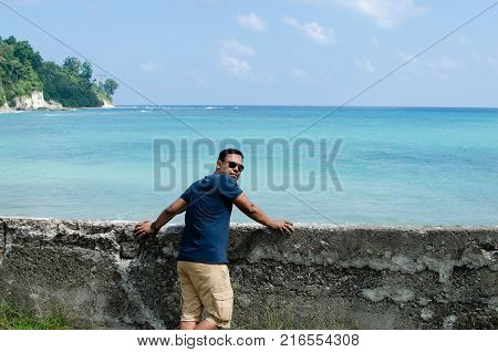 Man Standing at the beach and Looking at the sea