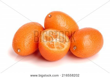 Cumquat or kumquat with half isolated on white background close up.