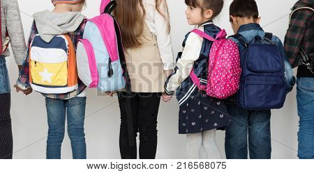 Group of Schoolers Kids with Backpack Behind Rear View on White Blackground