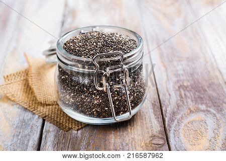 Healthy chia seeds in a glass jar. Healthy eating concept. Copy space