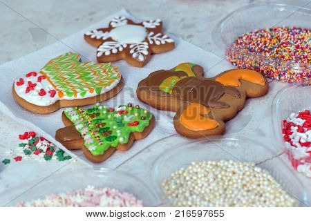 Homemade Christmas Gingerbread Decorated In The Form Of Mittens On The Background Of A White Napkin