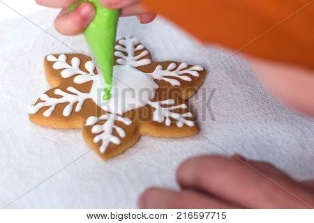 Homemade Christmas Gingerbread Decorated In The Form Of Mittens On The Background Of A White Napkin